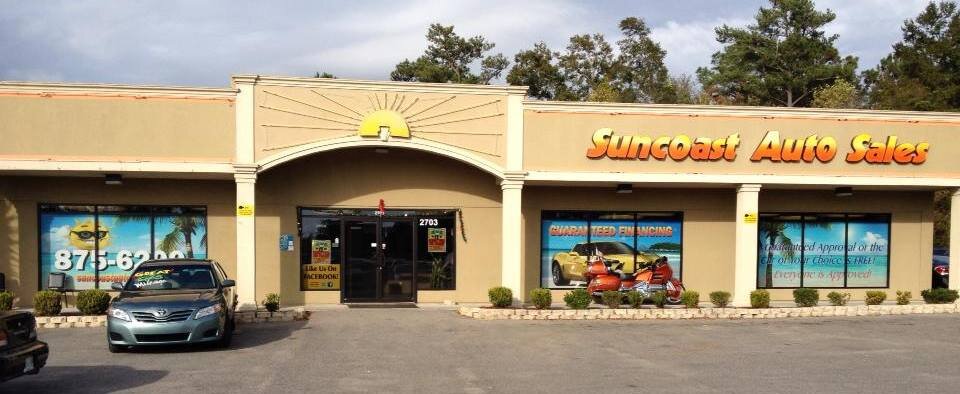 Storefront of Suncoast Auto Sales & Service, Ocean Springs.